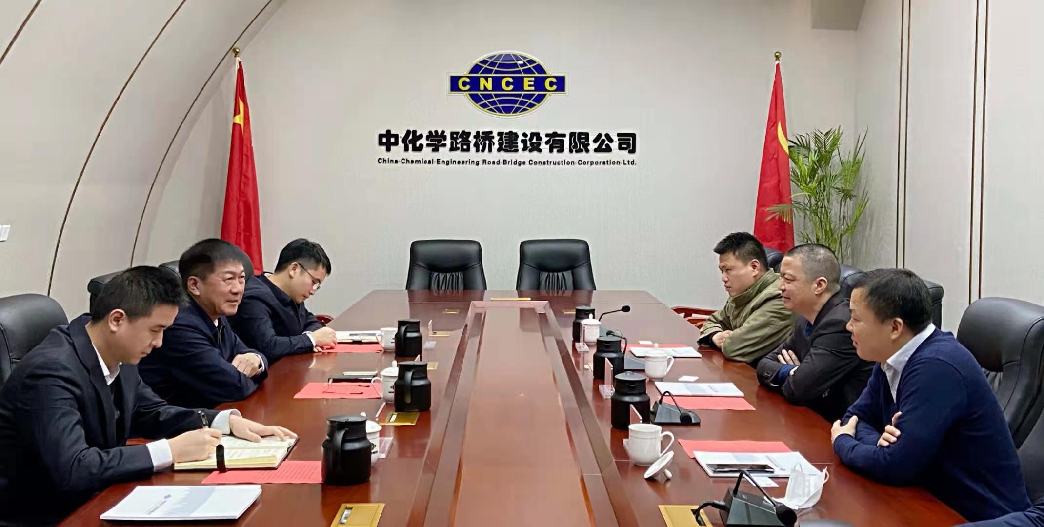 李论拜会中化学路桥建设有限公司总经理房如义 李论拜会中化学路桥建设有限公司总经理房如义